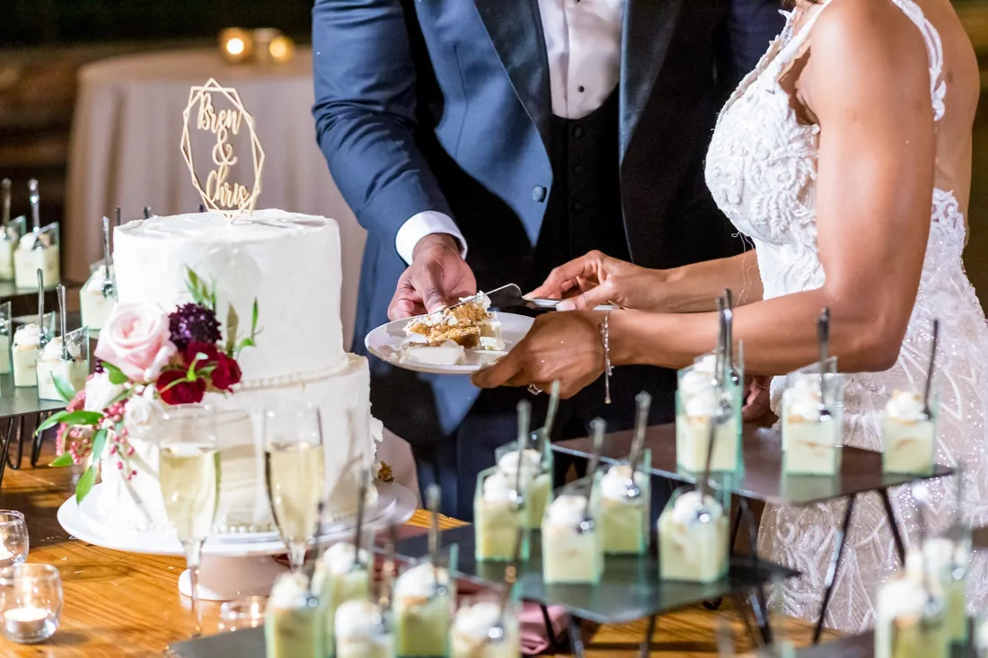 Wedding reception with guests and a wedding cake